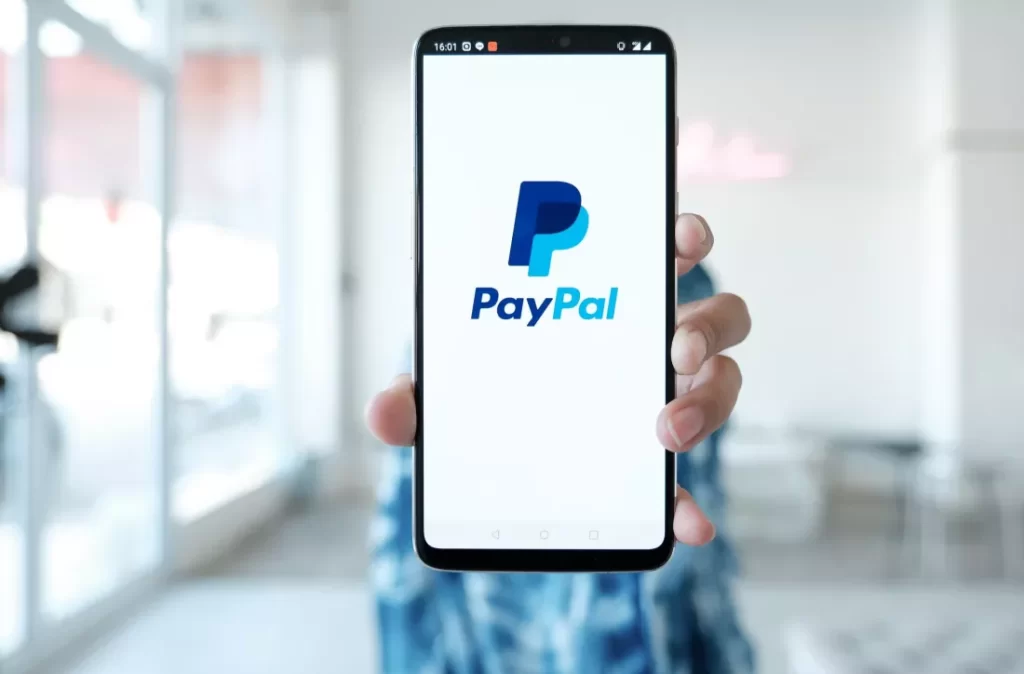 how old do you have to be to use PayPal? the service or platform to buy, sell and make basic financial transactions across over 200 countries and regions of the world. So, the question, how old do you have to be to use PayPal? Is not out of place at all, In fact on the contrary, it is very necessary and we consider it as important and treat it is as such. Hence this article, though it is pertinent to state that PayPal helps you carry out your basic money transfers and you need not worry about your financial information getting compromised. PayPal has the ability to simplify your online transactions and is designed to be as easy as possible. You could use PayPal for a number of functions such as business transactions across companies or make online payments and buy items on e-commerce sites if you’re shopping at a store, splitting expenses or receiving payment for a job. How Old Do You Have to Be to Use PayPal or have an Account? According to PayPal terms of service and customers agreement, you must be at least 18 years of age to sign up for an account. The PayPal User Agreement states, “If you are an individual, you must be a resident of the United States or one of its territories and at least 18 years old, or the age of majority in your state of residence open to a U.S. PayPal Account to use the PayPal Services.” This decision is arrived by a number of deciding factors large part lies in the fact that you must be 18 years of old to engage in a legally binding contract. And apparently, signing up for a PayPal account is engaging in a legal contract, it follows said rule to avoid the incident of a ton of liability. How do You Open an Account with PayPal You can open a paypal account easily, and completely free and use the balance you have for purchases. The app will securely manage and store your debit card, credit card or any banking information you use for the registration. First, simply sign up on PayPal using your email address, add your correct banking details and then make purchases with funds from your account. Can You Get In Trouble if You Don’t Meet the Age Requirement? It clearly outlines in the User Agreement that you must be at least 18 years old or the age of majority in your state of residence. But what if you didn’t know when you signed up? Or, what if you did and now you have found yourself in a pickle? The simple answer to whether or not you can get in trouble if you open a PayPal account if you are under the age of majority is yes. However, that doesn’t necessarily mean you will get in trouble. There are a few things to take into account. The User Agreement also outlines a list of restricted activities. It basically states that if you use PayPal and break the binding agreement, they can take different actions against you. A few of the restrictions include: Breaching the User Agreement in any way Violating any law, statute, ordinance or regulation Selling counterfeit goods Act in a defamatory manner that is threatening or harassing Provide false, inaccurate or misleading information Control an account that’s linked to another account that has engaged in any restricted activities And a long list of others From here, PayPal reserves the right to take action that could include: Terminating the agreement, limiting your account or closing your account (even if there is a linked cash account), at any time Refuse to provide PayPal services Limit access to their services Hold any balance that you have for up to 180 days to protect against the risk of liability Contact your bank or credit card issuer or any other impacted parties or law enforcement about your actions Take legal action against you Okay, that’s a lot of legal jargon to try and process. But the point is that legal action can be taken against you if you take part in any of the outlined restrictions. And that includes having an account if you aren’t the age of majority. It might not seem like a huge risk, but it could have unintended consequences down the road. Think about this. Let’s say you go through the application process for PayPal a few months before you reach the age of 18 in your state. Yet, you are running financial transactions of sending and receiving money and funds on your PayPal to account as well as engage in multiple subscriptions. But then, PayPal recognizes an issue and places a limitation on your account or they outright ban you for breaching the User Agreement you agreed to when you first signed up. You will lose access to any availability of funds. Now what? What do you do about the funds you still have in your account? Here is what you do, You will have to spend time figuring out everything you had linked to your account. You will have to contact employers or clients and set up a new way of sending or receiving payments. Automatically, may have to start from scratch. Not only that there could also be legal issues. If you created a PayPal account when you were not in the legal contract age, the best thing you can do is close your account and restart. It might be a difficult choice, but it’s better than the alternative of running into substantial issues down the road. Furthermore, it is best you wait than consider opening a PayPal account while still under the age of 18. There are other alternative payment platforms that you may use when you sign up with your parent’s permission. Either way, it is important you understand the details of a user agreement before signing up. How to use Paypal PayPal can be used in two different ways either with a personal account or with a business account. On a PayPal's personal account you can send or receive money from friends and family, as well as easily make purchases or settle up with a friend. Also, you can use your PayPal personal account to receive any money you earned for completing a job or selling a product or service from an international client. Once you receive your funds, they are secured in the app and you can then opt to make a transfer to a linked bank account or a debit card if you have one in your profile. For a business paypal account, this account is recommended for anyone who wants to primarily use their PayPal account for business purposes only. Perhaps a company who markets a product or service or receive different types of donations internationally. To sign up for a business account, you will be required to use your company or business name. You can also tweak your PayPal business account in a way that it allow your employees to access some of the features in it, which can make managing payments more convenient. Keep in mind that using a business account can be subject to certain levy and charges that are different from using a personal account. If you aren’t sure which one you should opt for, it is best you open a personal account first. This is because on a personal account, you can easily switch it to a business account after a while. But of course to do that, PayPal has to be aware and approve that you will now be using your account primarily for business or commercial purposes. PayPal's Restriction on Transfers or Withdrawals PayPal have the ability to limit the amount you can withdraw from your account depending on different factors. Withdrawals can also get delayed in certain but rare cases commonly if PayPal feels the need to confirm you have the right authorization. Some of the events this may happen is with Chargebacks, bank reversals or disputes from buyers. If PayPal puts a limitation on your account, this may be due to a payment being on hold or your account having a negative balance. If this happens, you will have to restart the withdrawal process after the limitation gets lifted or your negative balance is paid off. Those steps to lift the limitation on your account may include verifying your bank account, providing a social security number, or confirming a debit or credit card.